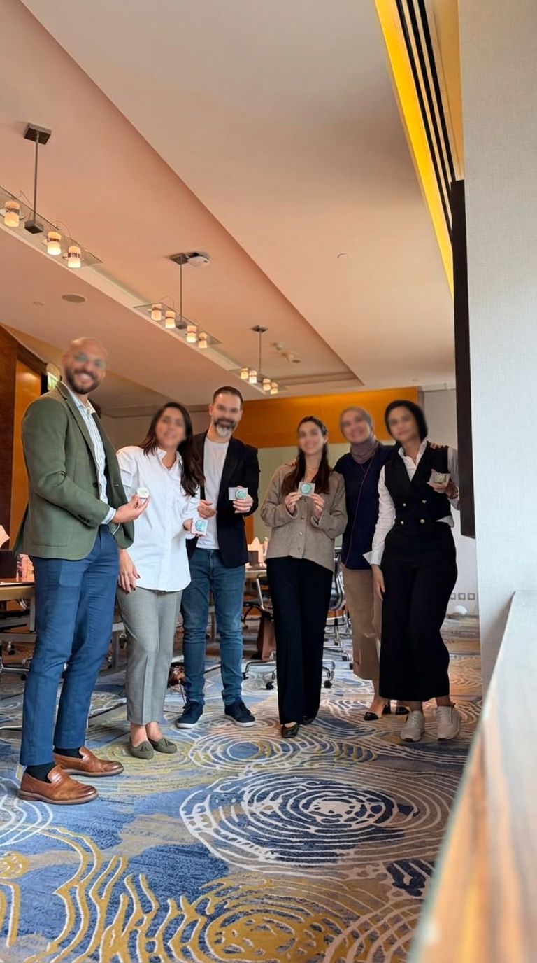 A small group of professionals standing together after a session