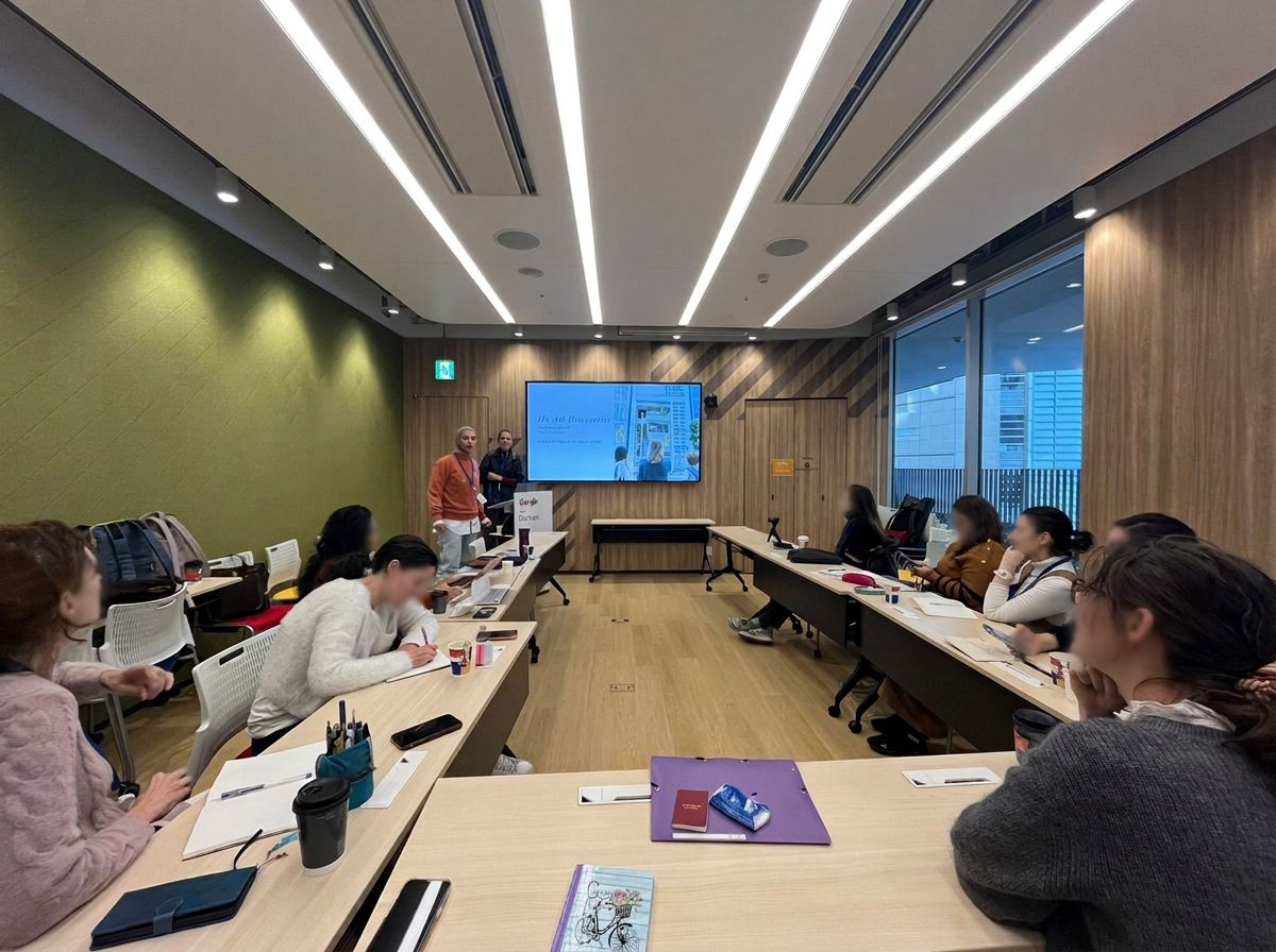 Participants seated at tables during a classroom style executive education session