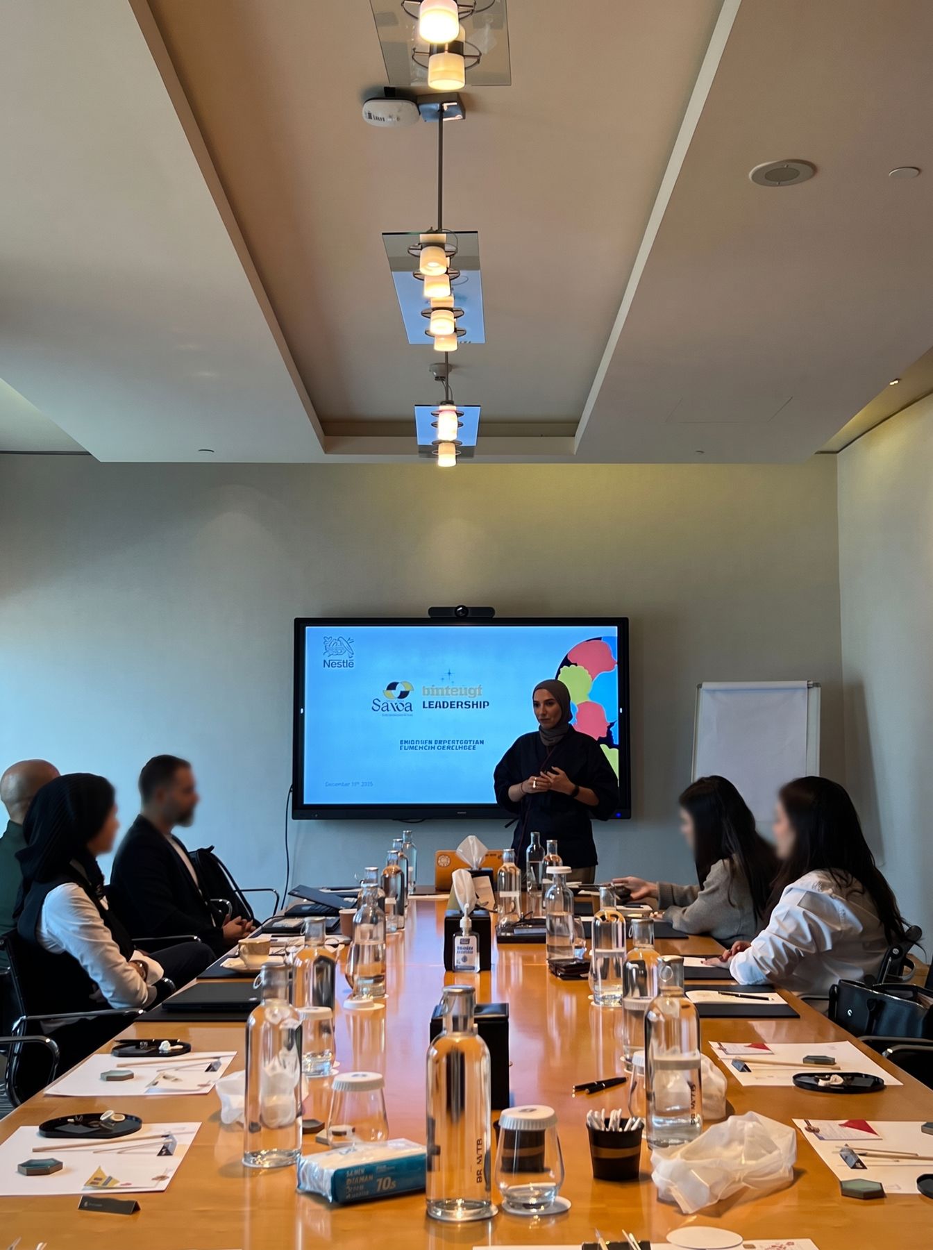 A facilitated session around a long conference table