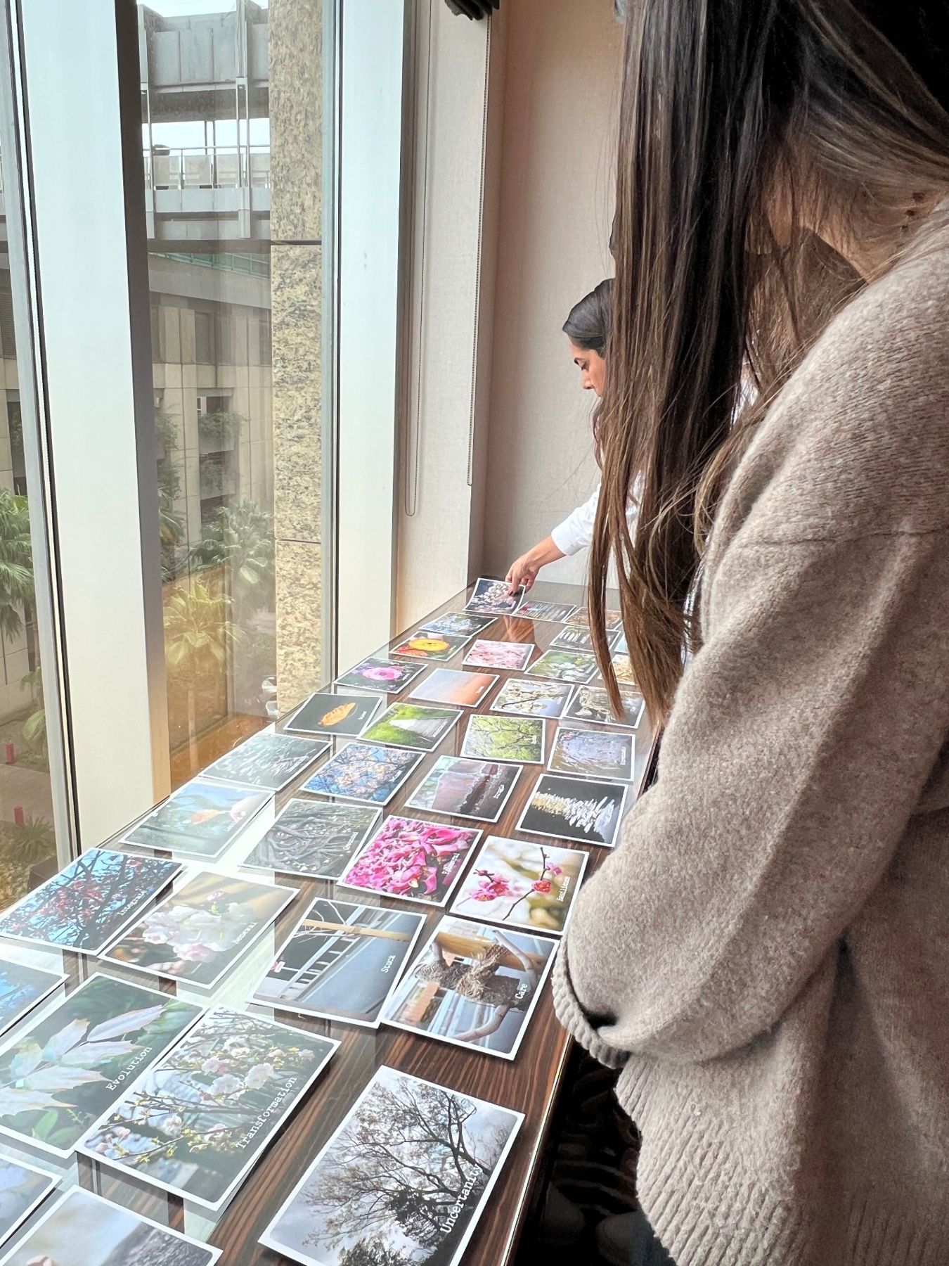Participants choosing reflection cards during a guided SAWA exercise
